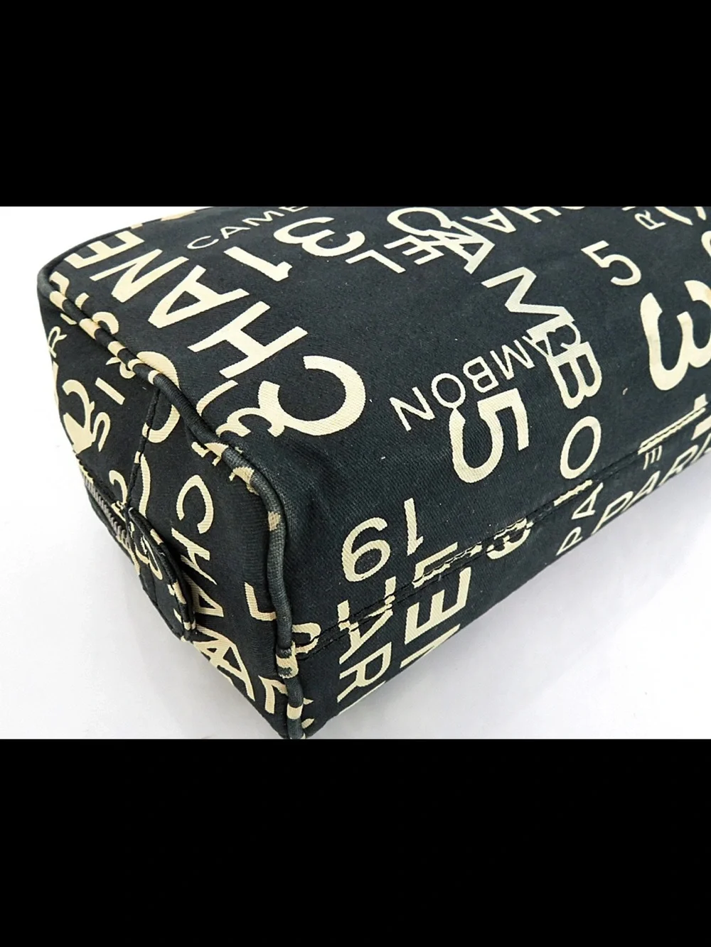 CHANEL Black Canvas Logo Print Cosmetic Pouch with Cream Lettering